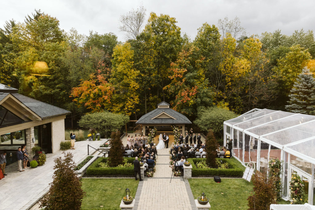 Couple getting married in a backyard wedding in the autumn